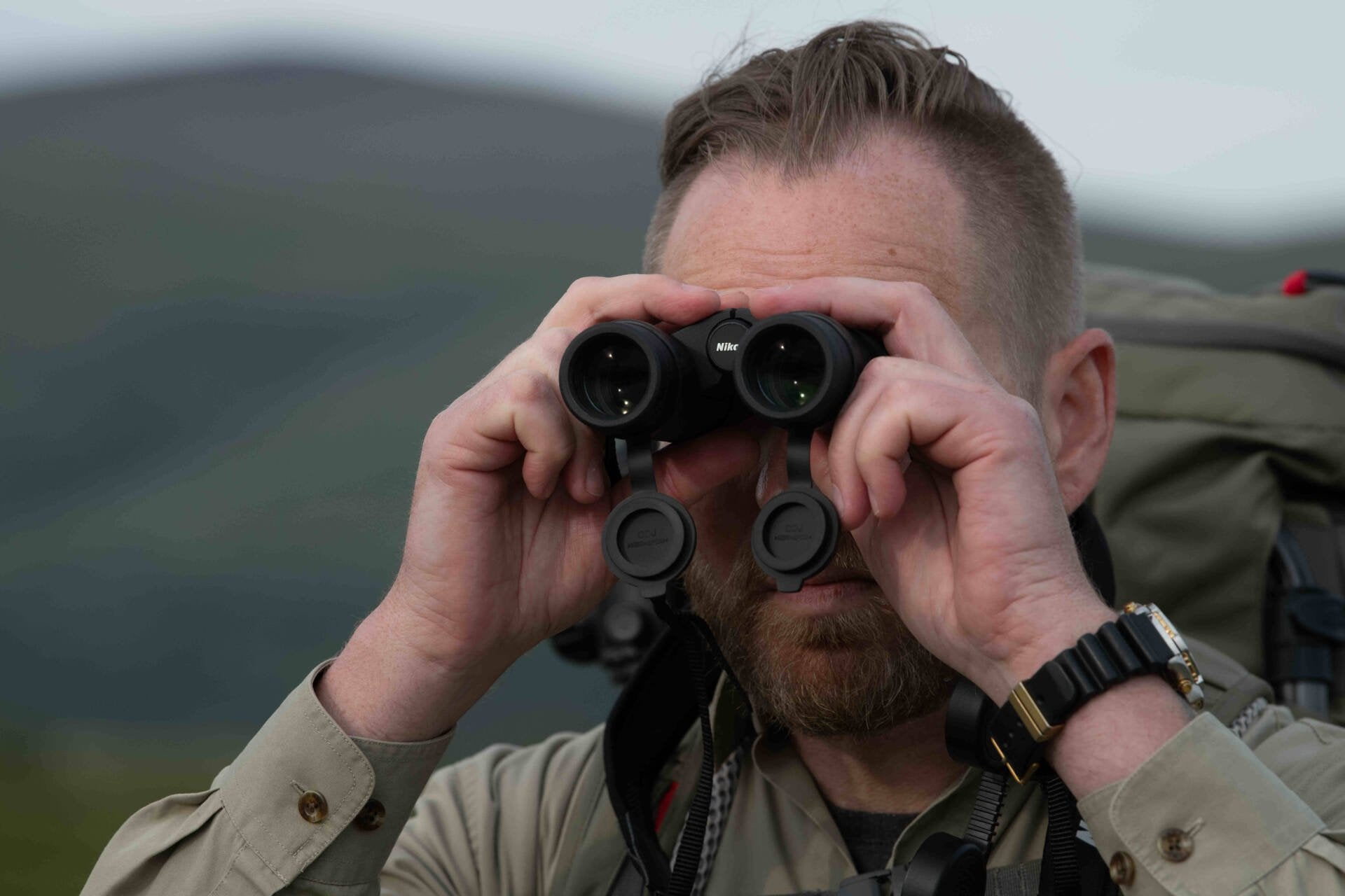A man using the Nikon Monarchs in the field showing a compact aspect
