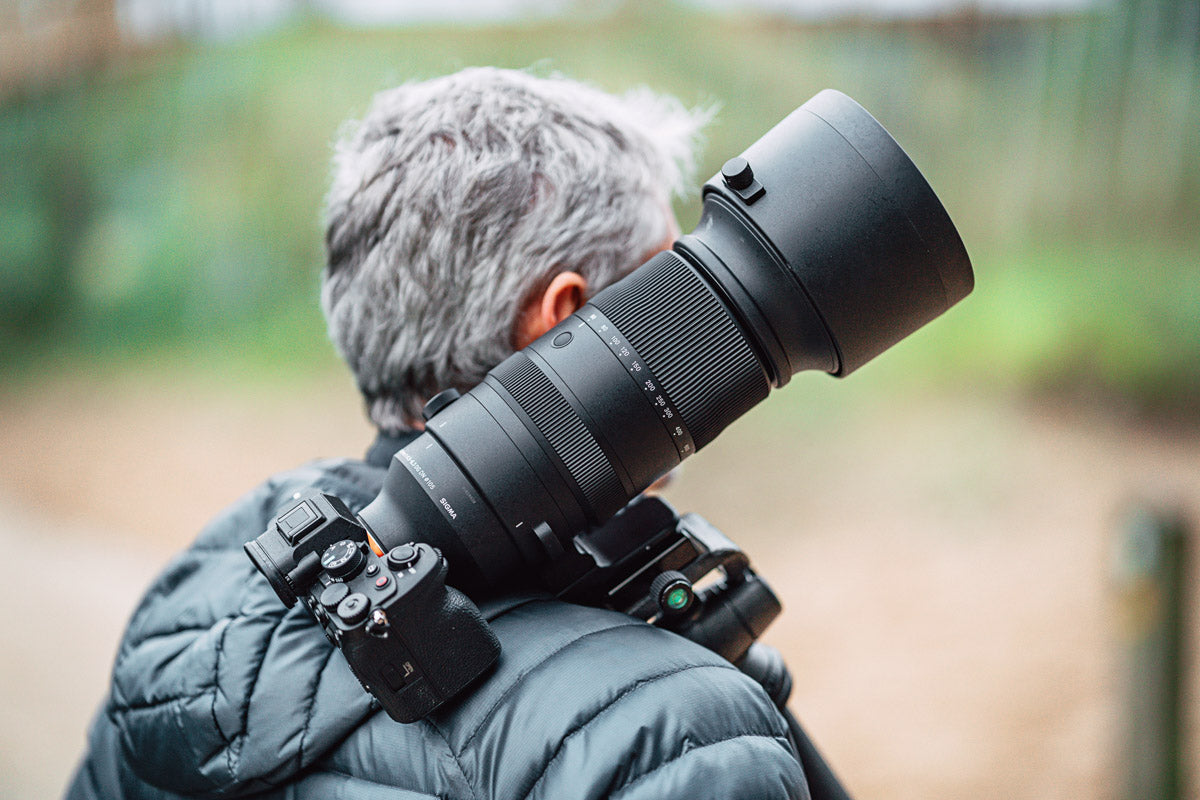 Lifestyle photo of the lens being carried