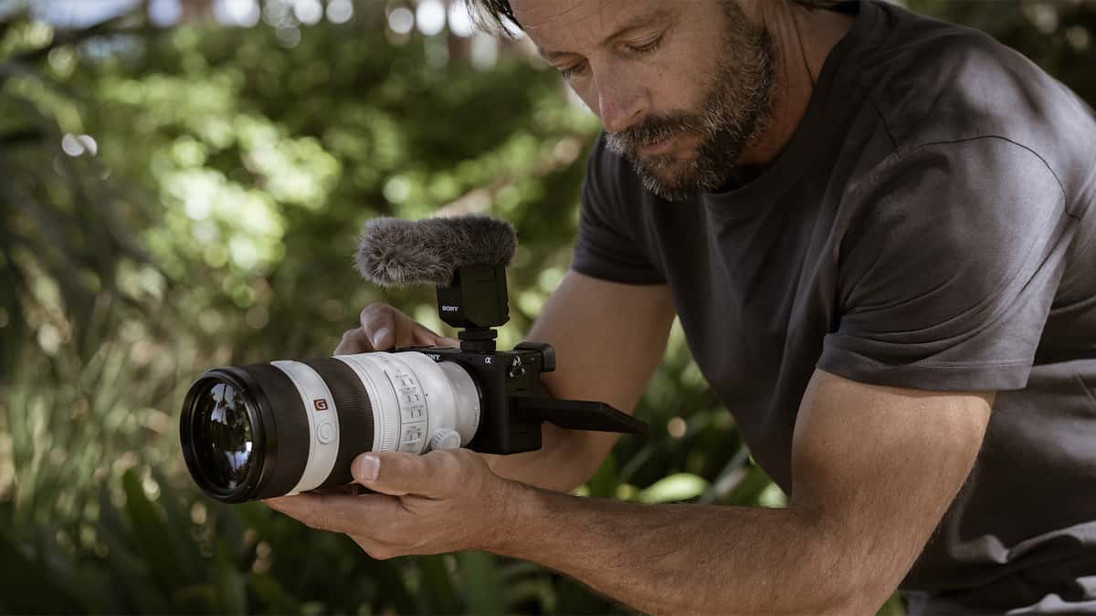 Man with camera in the field