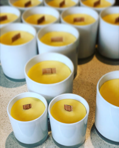 golden yellow beeswax candles stand in a row