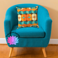 teal-orange-and-brown-geometric-mid-century-modern-double-sided-throw-pillow-on-a-blue-chair