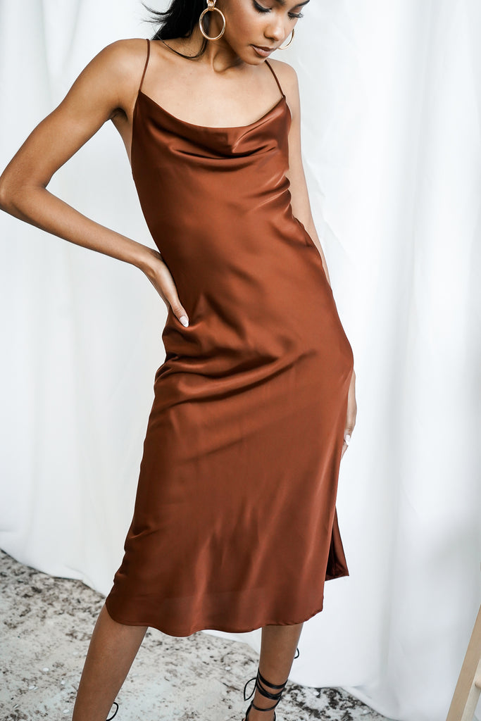 A maxi dress featuring a cowl neck, and cami straps.