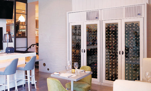 restaurant interior with bar and large wine cabinets