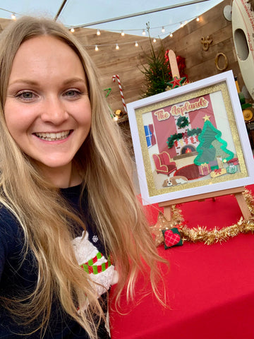Bethan and her paper Christmas living room art in box frame in the Kirstie's Handmade Christmas tent