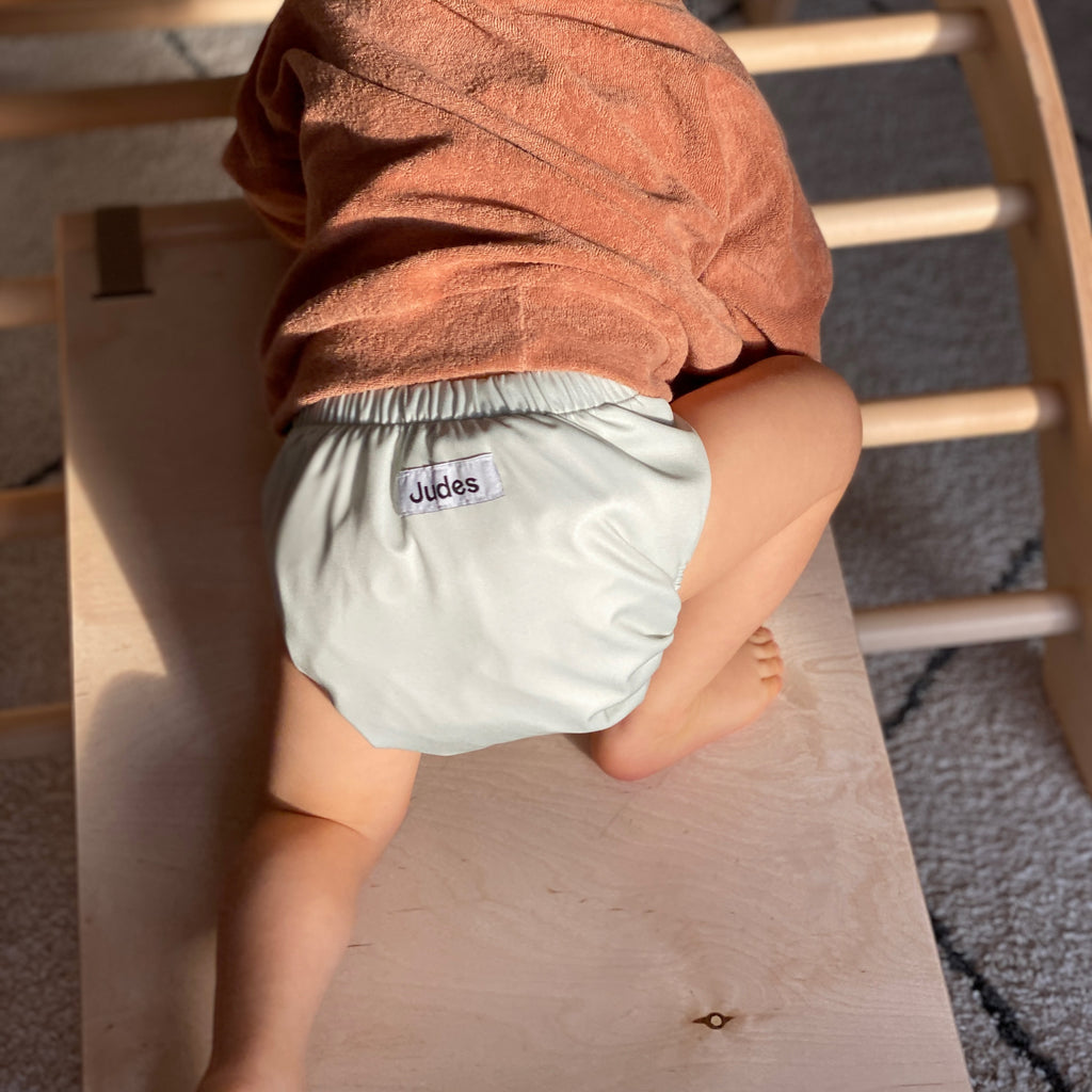 Judes baby climbing sage cloth diaper wood