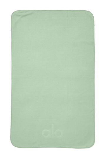 Grounded No-Slip Towel in Honeydew by Alo Yoga - International Design Forum