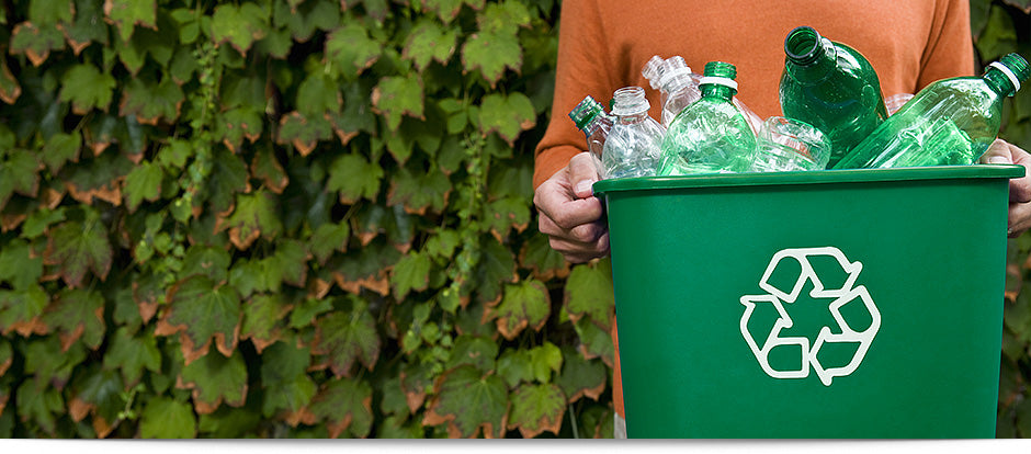 MAn Recycling bottles at home