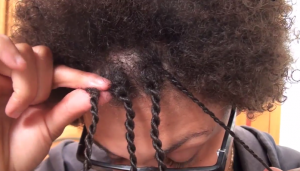Putting hair in twist braids