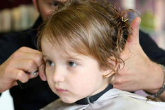 Toddler getting hair cut