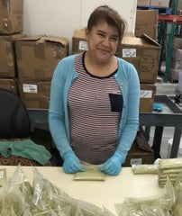 Woman Packaging Henna Powder