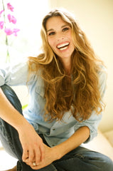 Woman With long curly healthy hair smiling
