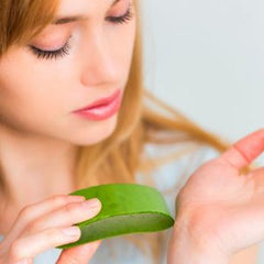 Woman holding aloe vera