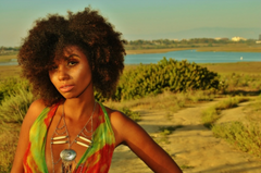 Woman in feild with natural textured hair