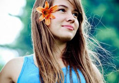 Woman with flower in her hair smiling