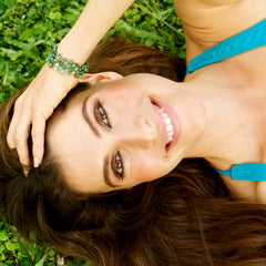 happy woman laying in grass