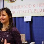 woman talking at raw living expo