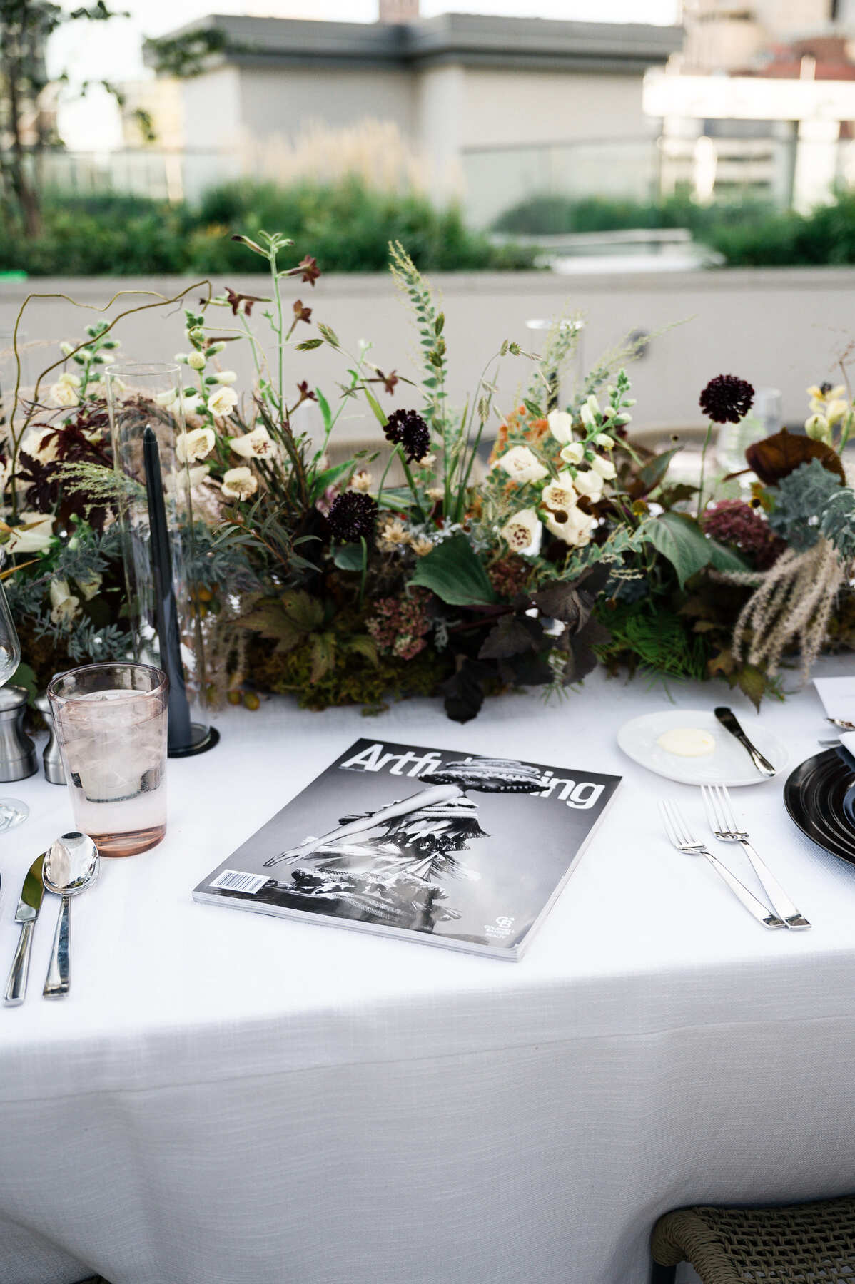 artful living magazine on a table at event