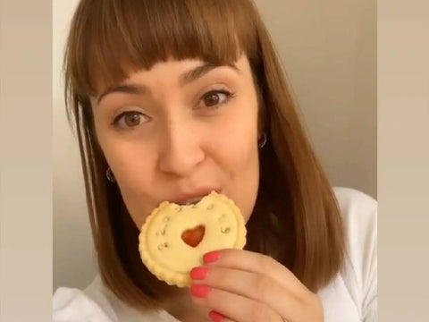 Amy Louise Crisp influencer enjoying a jam biscuit from The Biskery