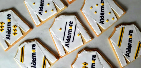 Hand iced branded biscuits made by The Biskery