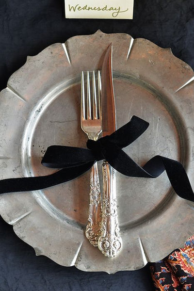 ribbon tied in a bow around silverware