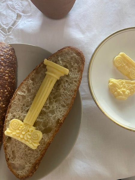 butter in the shape of a greek column