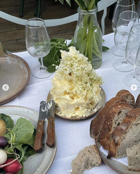 tall mound of butter with baby's breath flowers