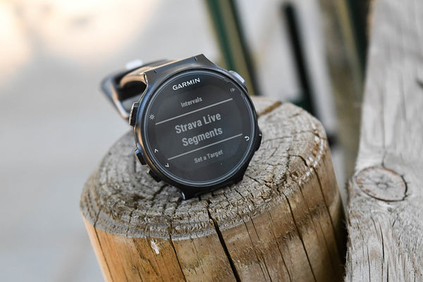 Image of a Garmin running watch with the Strava interface on its face. Photo by DCRainmaker.