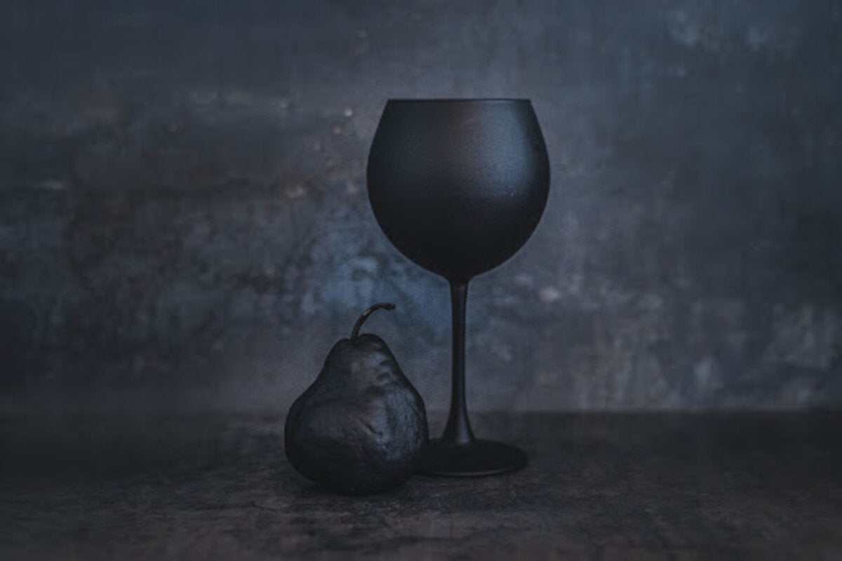 Black pear and black wine glass