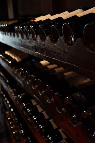 Bottles of wine on a wine rack.