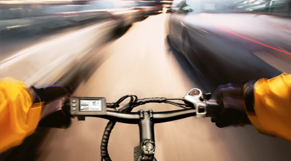 POV View of Man riding Hovsco Bike Through traffic moving fast