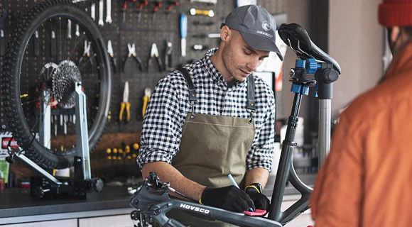 Technician Helping a Customer with his Hovsco Bike 