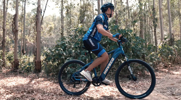 Man Riding Hovsco HovRanger electric Mountain Bike on Trail in forest