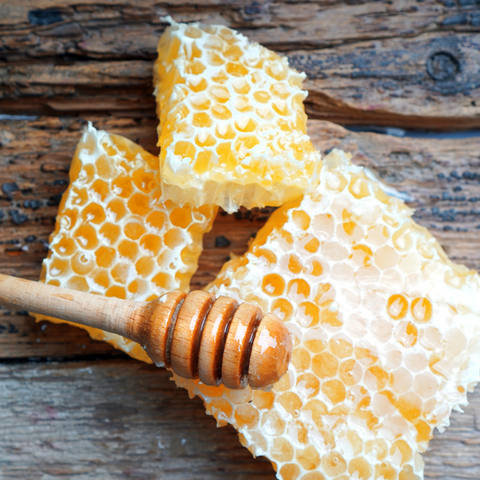 Yellow Natural Bee Wax With A Piece Of Honey Cell On A White