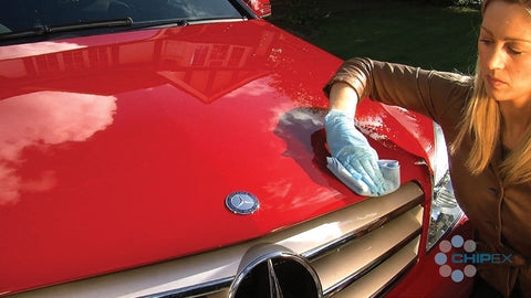 close up woman polishing car bonnet 