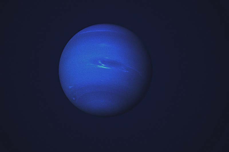 Beautiful blue Neptune set against the dark canvas of space, representing the theme of Neptune Retrograde in Pisces and the idea of navigating illusions and delusions.