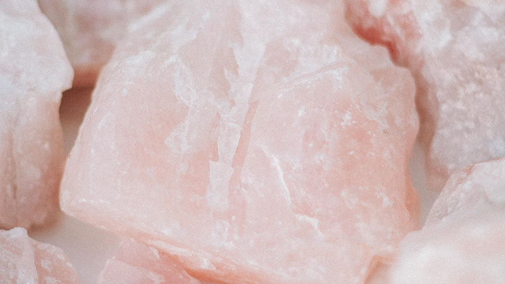 Close-up of pale pink rose quartz crystals, their gentle hue and translucent quality conveying a sense of calm and emotional healing associated with the Pink Moon