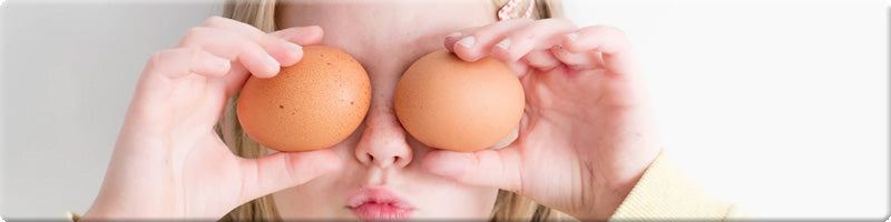 child with eggs