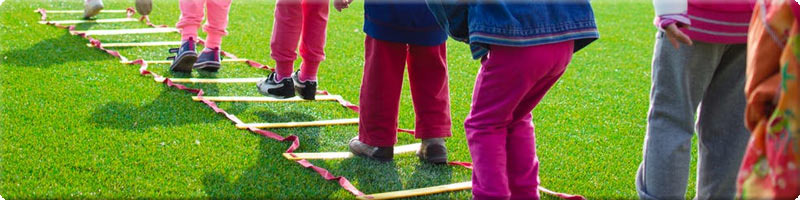 children in a team obstacle course race
