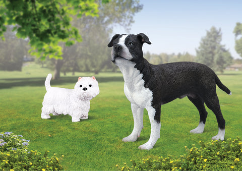 Unplugged play: two toy dog figures in a field