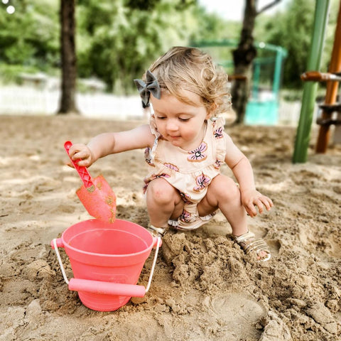 Girl playing with Eco Spade and Activity Bucket