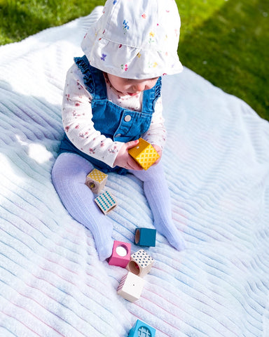 Baby playing with Sensory Blocks