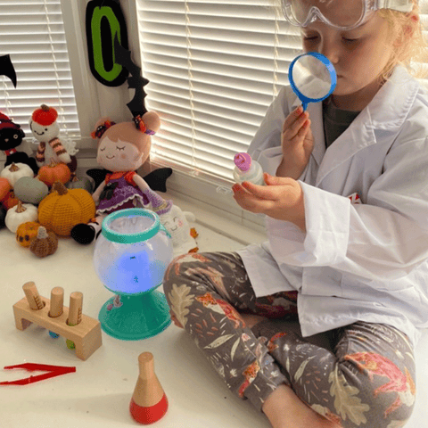 Girl playing pretend in Scientist Dress Up Set