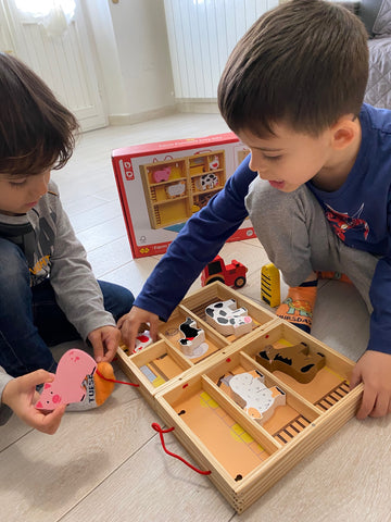 Two boys playing with Farm Animal Playbox