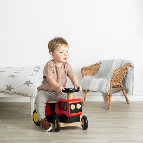 Ride on toys: Boy playing on Ride On Tractor