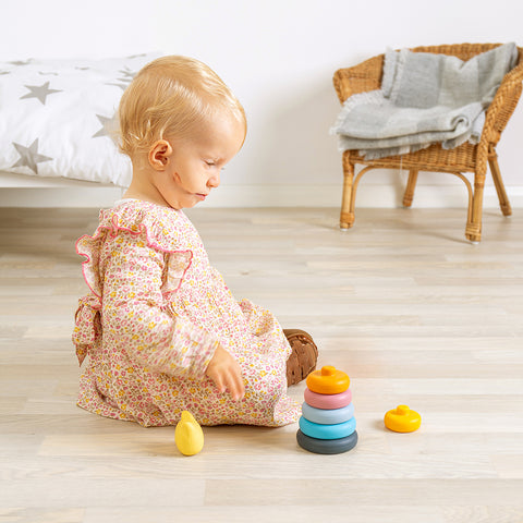 Girl playing with Stacking Cat silicone toy