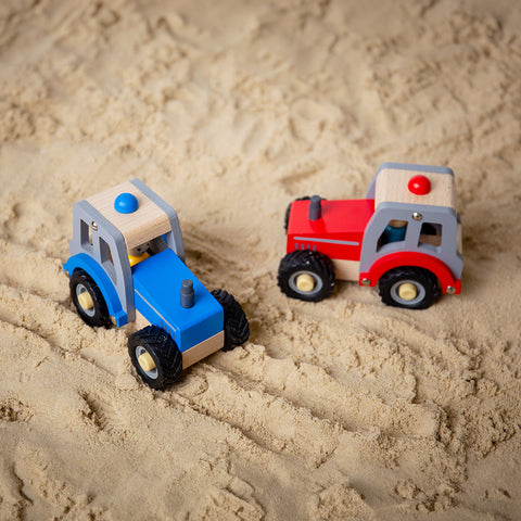 Blue & Red Tractor Toys in sandpit