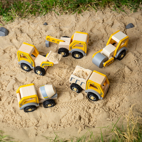 Mini construction vehicles in sandpit