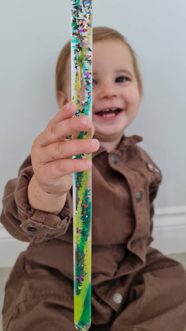 Toddler playing with Magic Tube party bag toy