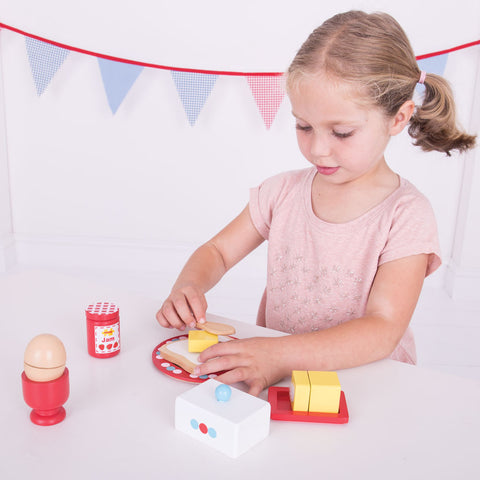 Girl playing with Breakfast Play Food Set