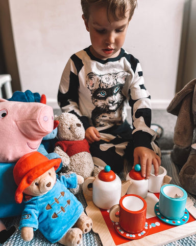 Boy playing with Tea Set On A Tray